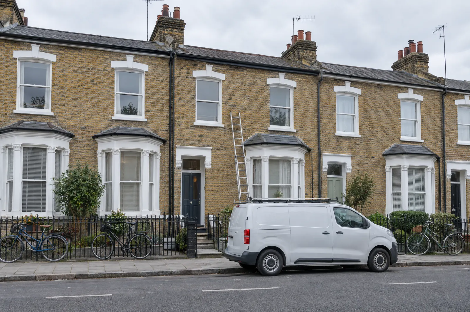 A Victorian terraced house with a builder’s van outside